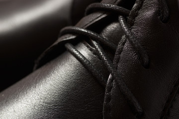 Black leather male shoes close-up