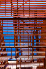 Abstract Architecture Background. Orange Metal Fire Escape Steps.