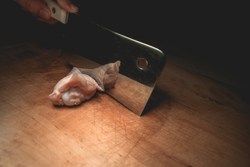 Raw chicken wings on cutting board. Selective focus.