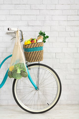 Fototapeta na wymiar Retro bicycle with net shopping bag full of fresh vegetables