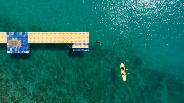 Aerial view of people kayaking near pier at the ocean, Mali Lo?inj, Croatia.