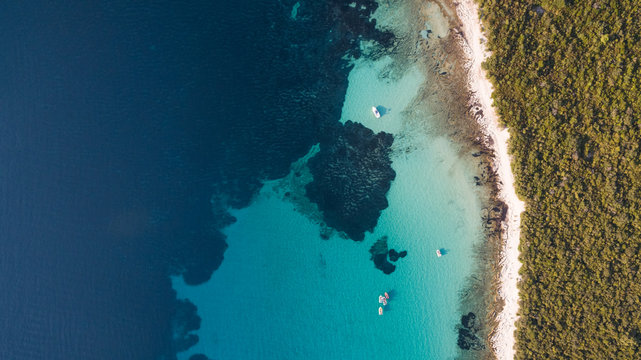 Aerial view of single speed boat floating over transparent water, Croatia.