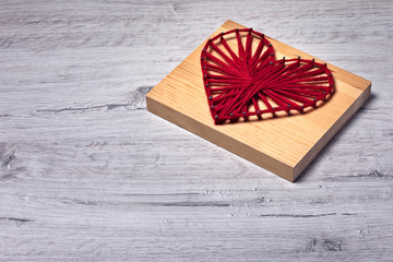 Valentine's day crooked string art red heart with space for greetings photo taken from below.
