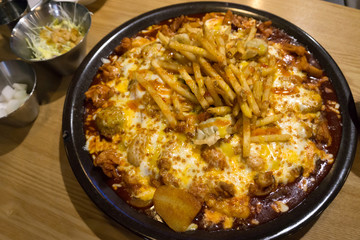 Close up Spicy Cheese Jjimdak with french fries