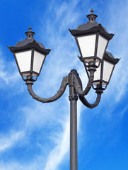 Fototapeta na wymiar Street lantern on background sky