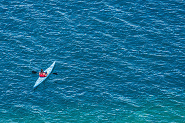 aerial photo of kayaker on lake