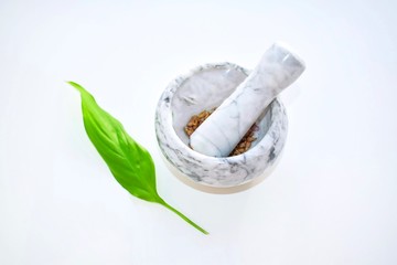 Natural cosmetics manufacturer with a green leaf on a white background. Isolated. Eco products concept.