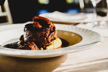 Exquisite veal dish with sauce served in luxury cutlery