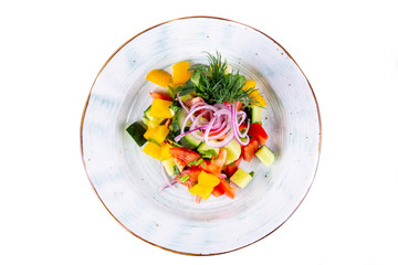 Vegetable salad filled with olive oil with greens
