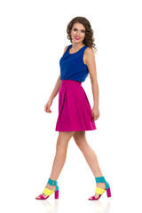 Beautiful Walking Woman In Colorful Clothes And High Heels