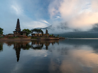 Indonesia, november 2019: Sunrise in Pura Ulun Danu Bratan, or Pura Beratan Temple, Bali island, Indonesia. Pura Ulun Danu Bratan is a major Shivaite and water temple on Bali island