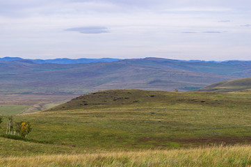 Fototapeta na wymiar Hills. Sky. The boundless steppe.