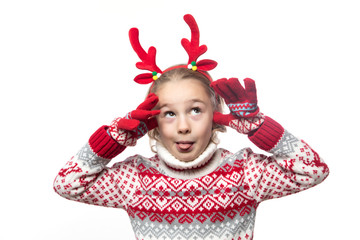 Cute young girl wearing deer horns. New year concept.