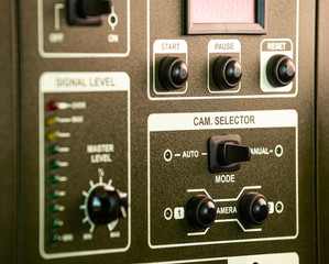 Obraz premium Close-up side view of panel of buttons and twirls