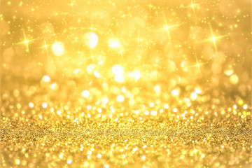 Luxury gold glitter with bokeh background, de-focused. concept for chrismas, holiday, happy new...