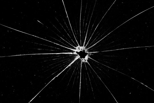 Abstract broken glass texture on a black background. Cracked black glass