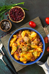 Thanksgiving Autumn Menu. Stew with beans and vegetables in a bowl on a rustic table. Top view of a flat lay with copy space. Copy space.