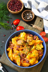 Thanksgiving Autumn Menu. Stew with beans and vegetables in a bowl on a rustic table.
