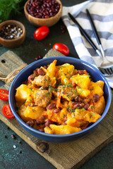 Thanksgiving Autumn Menu. Stew with beans and vegetables in a bowl on a rustic table. Copy space.