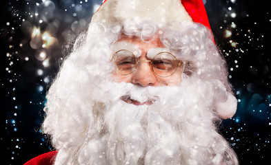 Santa Claus portrait in a glittery winter background setting
