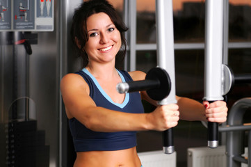 Woman doing exercise for arm muscles