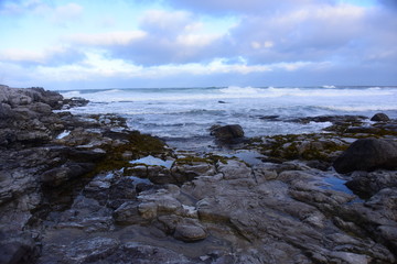 Fototapeta na wymiar Rocky Limestone Beach in Sea Storm