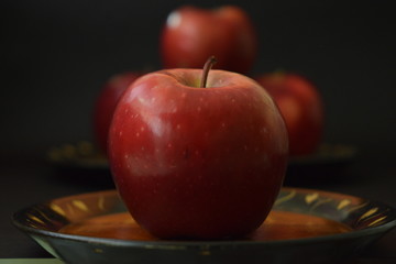 Red Apples On Wooden Plate Black Background