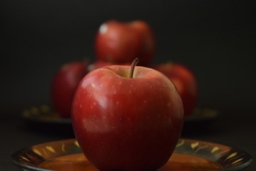 Red Apples On Wooden Plate Black Background