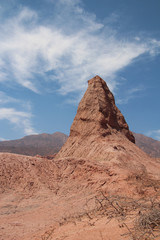 Fototapeta na wymiar A pyramid of red rock in the park of La Quebrada de las Conchas, Argentina