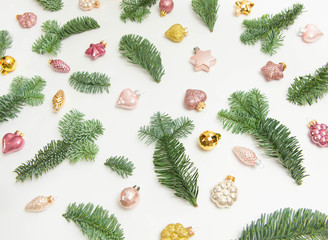 Christmas or New Year background: fir tree branches, glass balls, decoration and cones on a white background