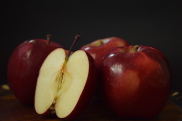 Red Apples Whole And Cut On Wooden Plate