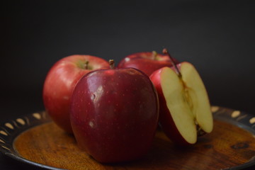 Red Apples Whole And Cut On Wooden Plate