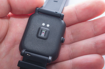 The back of smart watch with a pulse oximeter and arterial blood pressure sensor. 