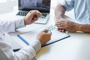 Doctor presenting with patient and checking results on report and prescription about the problem of illness and recommend using medicine, healthcare and medical concept