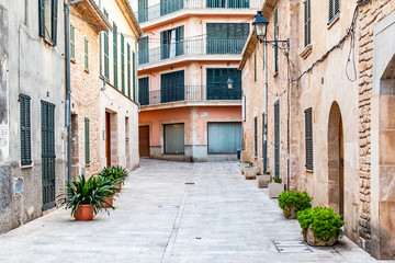 Fototapeta na wymiar Beautiful narrow historic streets of Alcudia Old Town in Majorca Mallorca