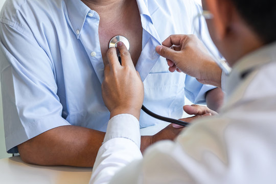 Doctor using stethoscope to listen checking Heart rate measuring to a patient in the hospital