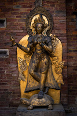 Fototapeta na wymiar ancient statue of the river goddess Ganga at Mul Chowk, Royal Palace in Patan, Kathmandu Valley, Nepal, Asia, Himalayan Country, Himalayas.