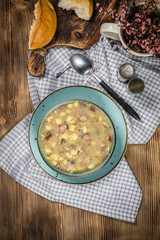Traditional polish soup Zurek in ceramic bowl.