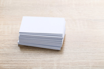 Blank business cards on brown wooden table