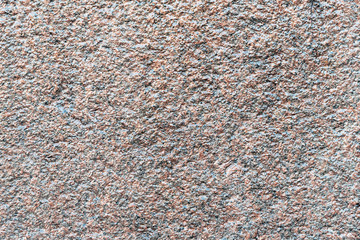 Brown gray granite wall texture. Stone background.