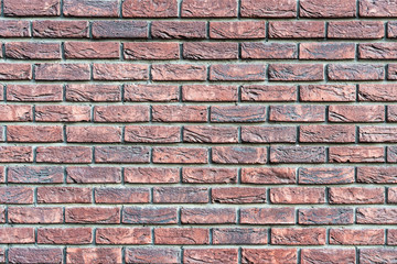 Wall texture of old brown rough brick. Grunge surface background. Vintage brickwall.