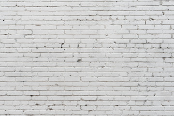 Wall texture of old white rough brick. Grunge surface background. Vintage brickwall.