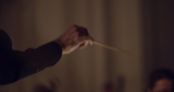 conductor's arm symphony orchestra
