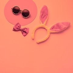 Fashion party girl layout Flat lay. Minimal. Woman Essentials night club accessories. Trendy sunglasses, rabbit. Coloful vibrant pink coral Set. Creative pop art fashionable concept