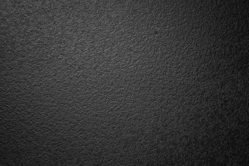 Abstract black textured faded wall background