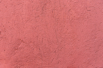 Texture of red stucco wall. Finishing construction work. Patterned background.