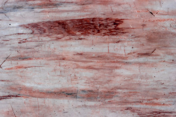 Old frayed white brown red marble texture background.