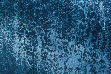 Frozen drops of water on glass, background