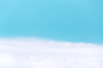 Blurred winter white snow and blue sky background
