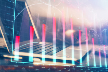 Financial chart drawing and table with computer on background. Multi exposure. Concept of international markets.